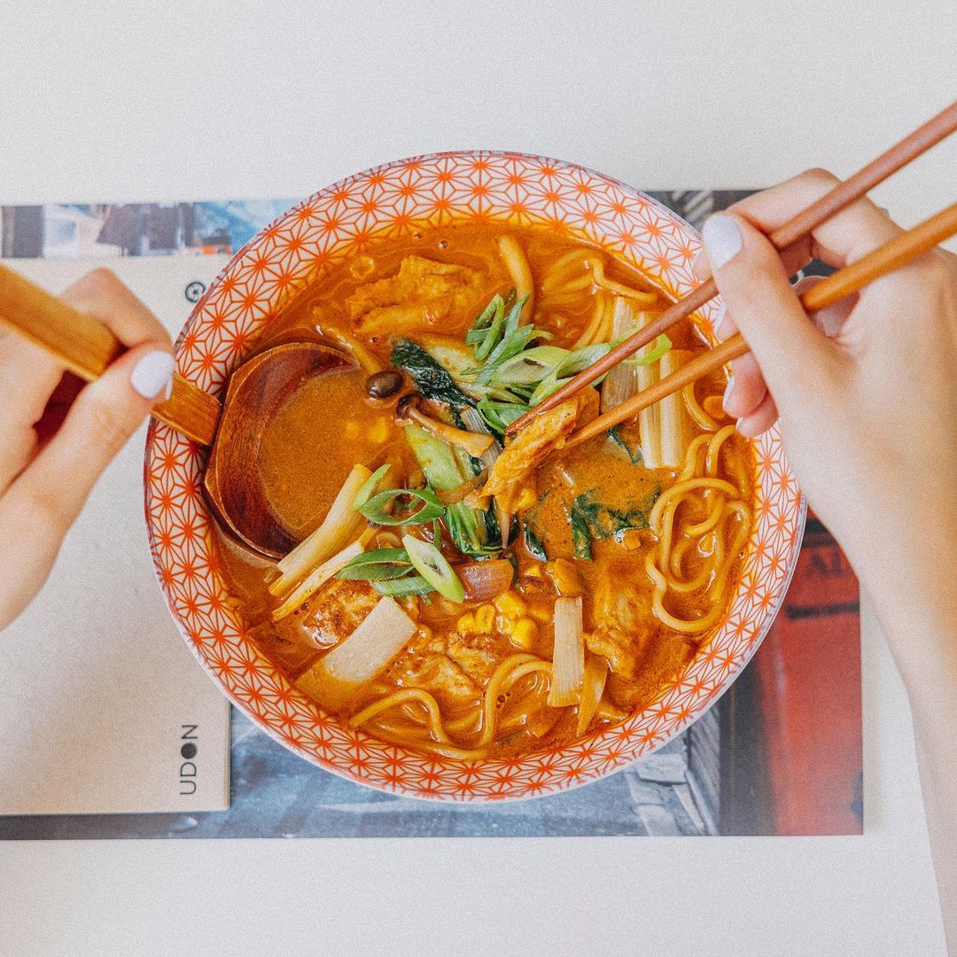 UDON's Vegan Ramen with vegetable broth and miso, plant-based protein, bamboo slices, red onion, cabbage, shimeji mushrooms, and corn at Aventura Mall